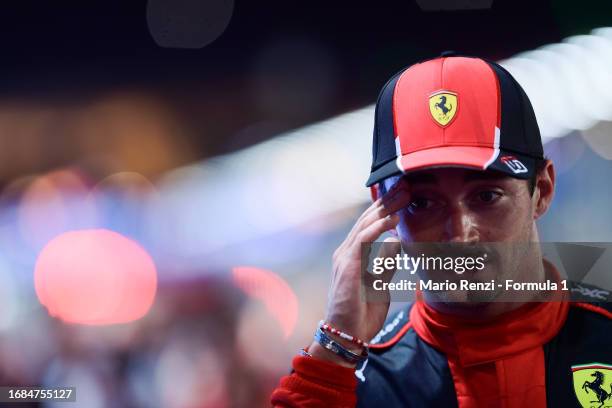 Third placed qualifier Charles Leclerc of Monaco and Ferrari looks on in parc ferme during qualifying ahead of the F1 Grand Prix of Singapore at...