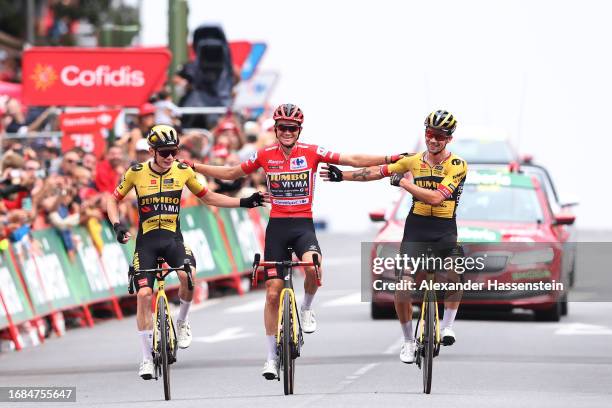 Jonas Vingegaard of Denmark, Sepp Kuss of The United States - Red Leader Jersey final overall winner and Primoz Roglic of Slovenia and Team...