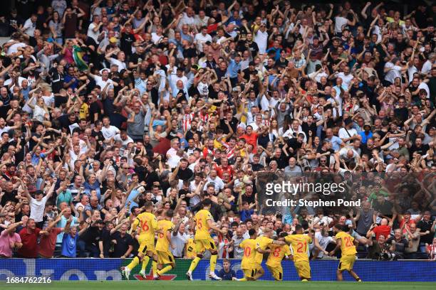 Gustavo Hamer of Sheffield United celebrates with team mates after scoring their sides first goal during the Premier League match between Tottenham...