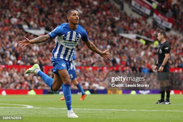 Joao Pedro of Brighton & Hove Albion celebrates after scoring the team's third goal during the Premier League match between Manchester United and...