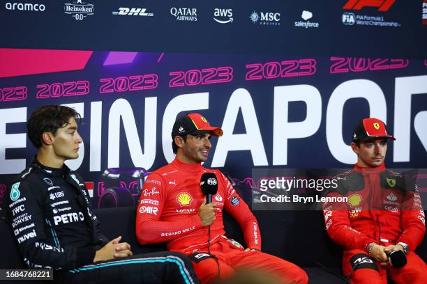 Pole position qualifier Carlos Sainz of Spain and Ferrari talks during a press conference after qualifying ahead of the F1 Grand Prix of Singapore at...