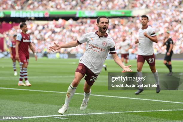 Bernardo Silva of Manchester City celebrates after scoring their sides second goal during the Premier League match between West Ham United and...