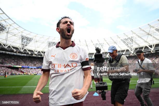 Bernardo Silva of Manchester City celebrates after scoring their sides second goal during the Premier League match between West Ham United and...