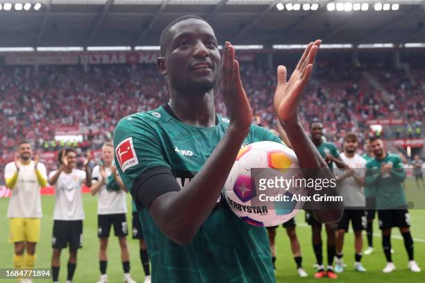 Serhou Guirassy of Stuttgart celebrates with the fans after scoring three goals during the Bundesliga match between 1. FSV Mainz 05 and VfB Stuttgart...