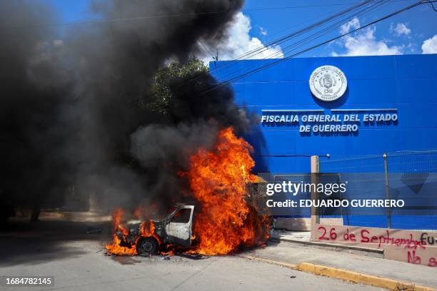 Pick-up truck set on fire by students of the Raul Isidro Burgos Rural Normal School of Ayotzinapa at the Attorney General's Office of the state of...