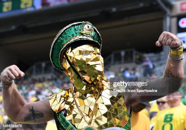 An Oregon Ducks fan shows his support during a PAC-12 conference football game between the Colorado Buffaloes and Oregon Ducks on September 23, 2023...