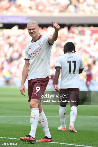 Erling Haaland of Manchester City celebrates after scoring the team's third goal during the Premier League match between West Ham United and...