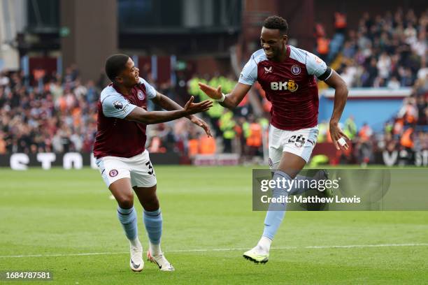 Jhon Duran of Aston Villa celebrates with teammate Leon Bailey after scoring the team's first goal during the Premier League match between Aston...