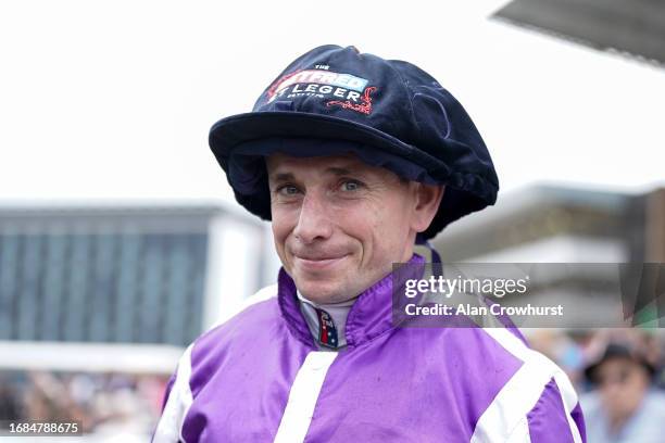 Jockey Ryan Moore with his winners jockeys cap at Doncaster Racecourse on September 16, 2023 in Doncaster, England.