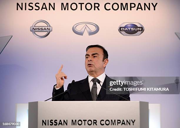 Nissan Motors President and Chief Executive Officer Carlos Ghosn announces the company's financial results of fiscal year 2012 at its headquarters in...