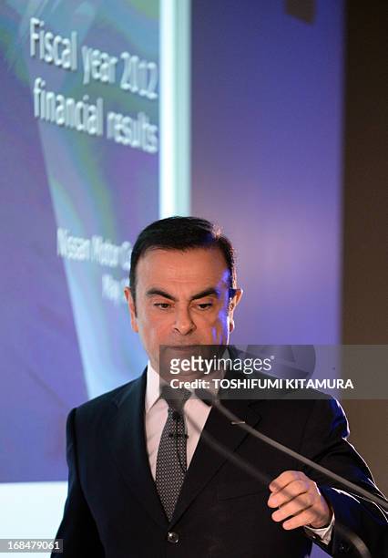 Nissan Motors President and Chief Executive Officer Carlos Ghosn enters the room to announce the company's financial results of fiscal year 2012 at...