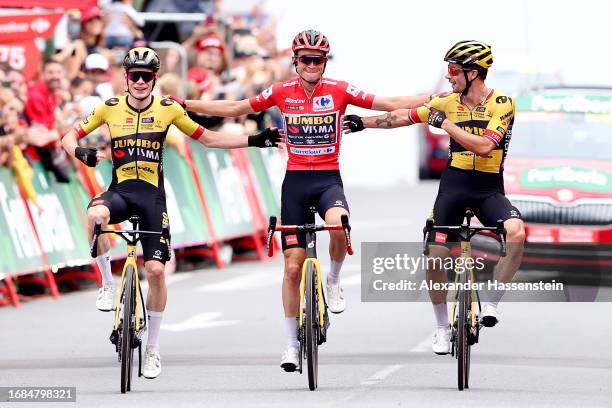 Jonas Vingegaard of Denmark, Sepp Kuss of The United States - Red Leader Jersey final overall winner and Primoz Roglic of Slovenia and Team...