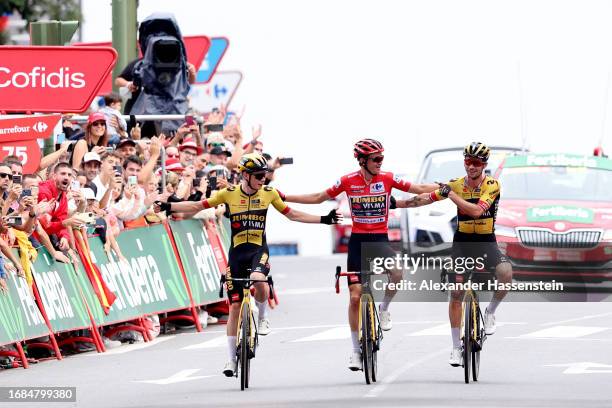 Jonas Vingegaard of Denmark, Sepp Kuss of The United States - Red Leader Jersey final overall winner and Primoz Roglic of Slovenia and Team...