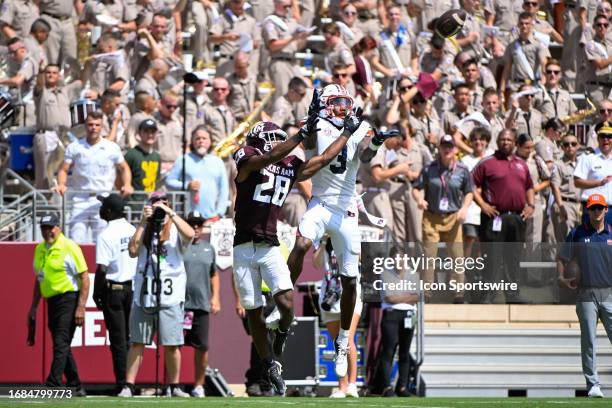 Texas A&M Aggies running back Israel Benjamin and Auburn Tigers cornerback Kayin Lee go after a 50/50 ball thrown near the endzone during the...