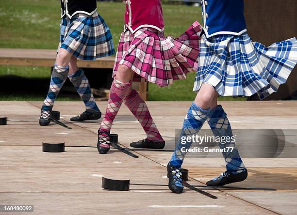 closeup of three pairs of feet of women scottish sword dancing - the 2011 braemar highland games stock pictures, royalty-free photos & images