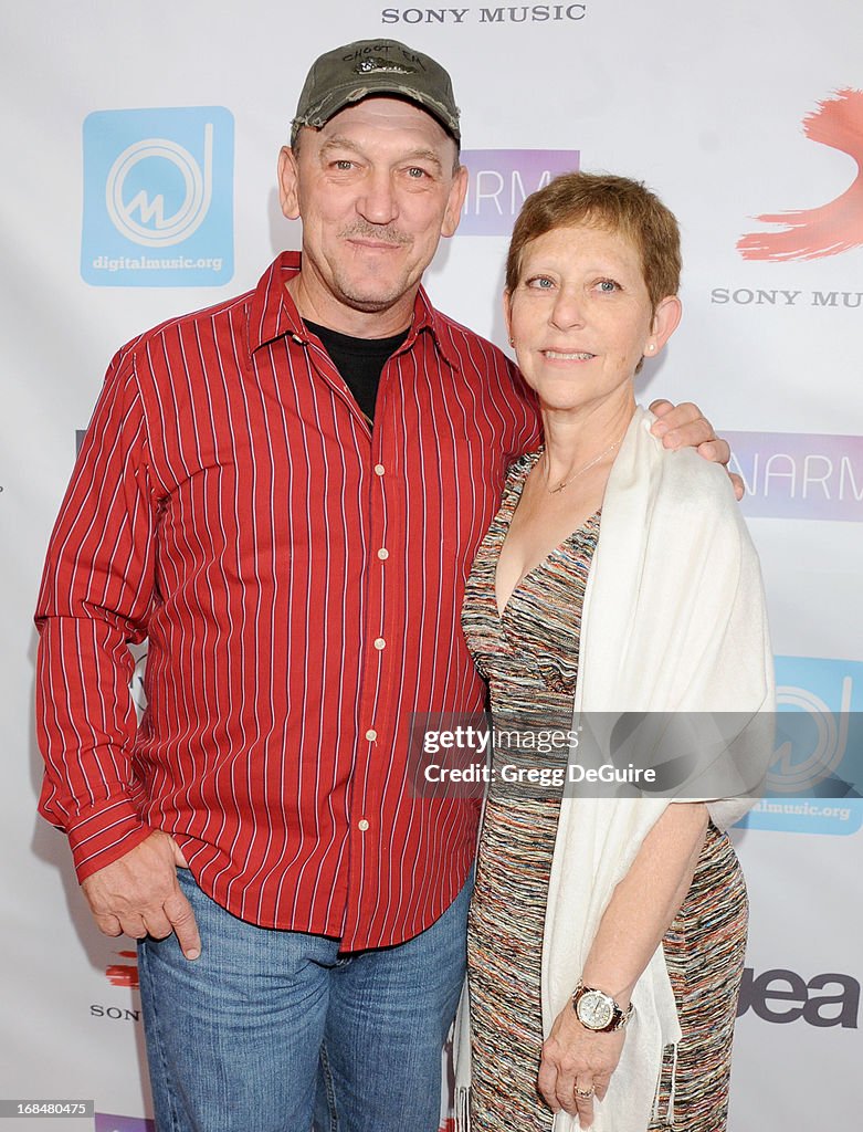 TV personality Troy Landry of "Swamp People" and wife Bernita arrive