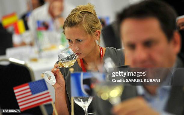 Professionals in the wine sector taste wine during a wine event, the Concours mondial de Bruxelles, labeled the “wine tasting world championship” in...