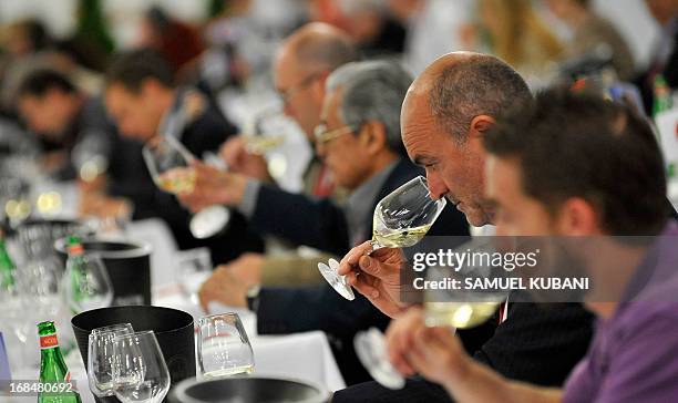 Professionals in the wine sector taste wine during a wine event, the Concours mondial de Bruxelles, labeled the “wine tasting world championship” in...