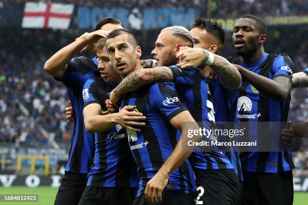 Henrikh Mkhitaryan of Inter Milan celebrates with team mates after scoring their sides first goal during the Serie A TIM match between FC...