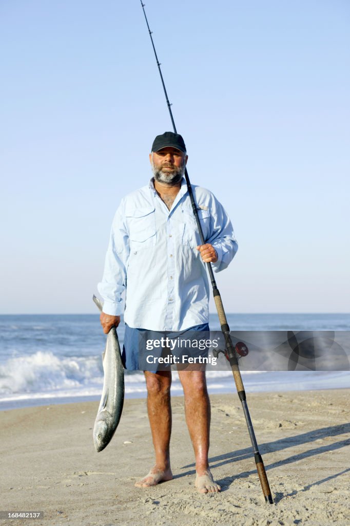 Surf fisherman with a bluefish