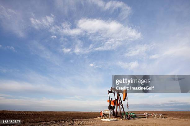 pumpjack with prairie sky - oil derrick stock pictures, royalty-free photos & images