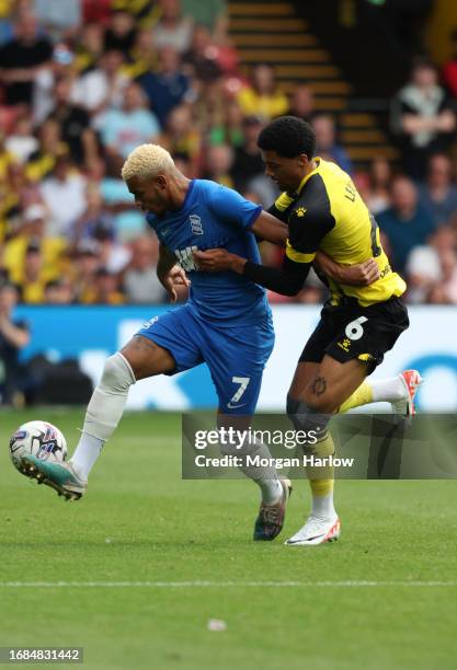 Juninho Bacuna of Birmingham City battles for the ball with Jamal Lewis of Watford during the Sky Bet Championship match between Watford and...