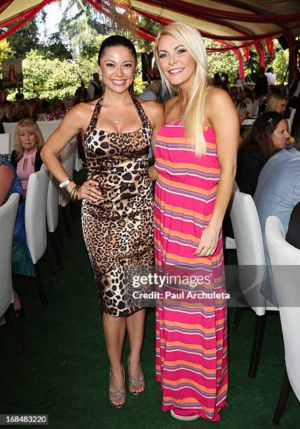 Playboy Playmates Pilar Lastra and Crystal Hefner attend the 2013 Playmate Of The Year announcement at The Playboy Mansion on May 9, 2013 in Beverly...