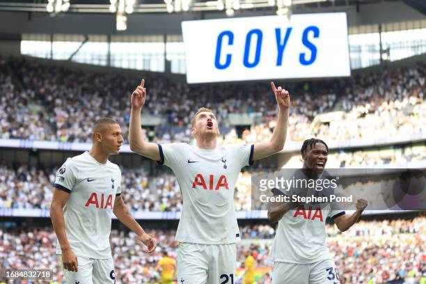 Dejan Kulusevski of Tottenham Hotspur celebrates with teammates Richarlison and Destiny Udogie after scoring the team's second goal during the...