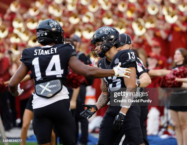 Wide receiver Jaylin Noel of the Iowa State Cyclones celebrates with teammate wide receiver Dimitri Stanley of the Iowa State Cyclones scoring a...