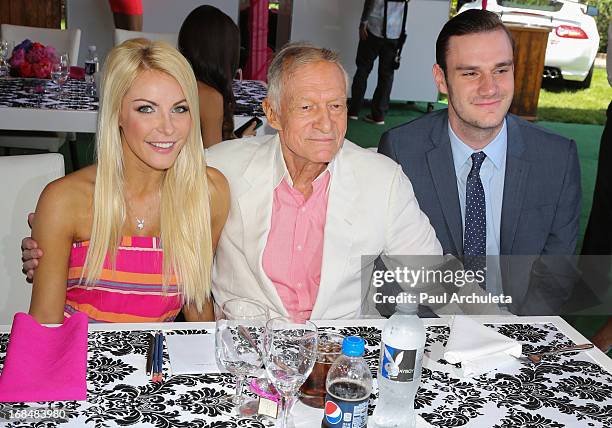 Crystal Hefner, Hugh Hefner and Cooper Hefner attend the 2013 Playmate Of The Year announcement at The Playboy Mansion on May 9, 2013 in Beverly...