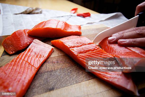 wild salmon raw fillet on cutting board - rustic salmon fillets stock pictures, royalty-free photos & images