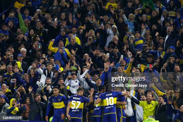 Lucas Janson of Boca Juniors celebrates with teammates after scoring the first goal of his team during a match between Boca Juniors and Lanus as part...