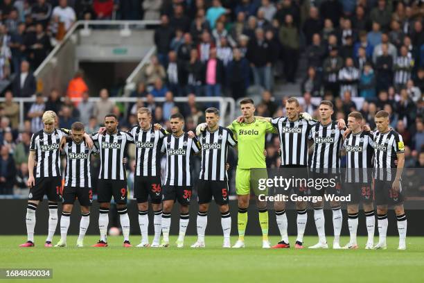 Players of Newcastle United, match officials and fans take part in a minute's silence for the victims in the Morocco earthquake prior to the Premier...