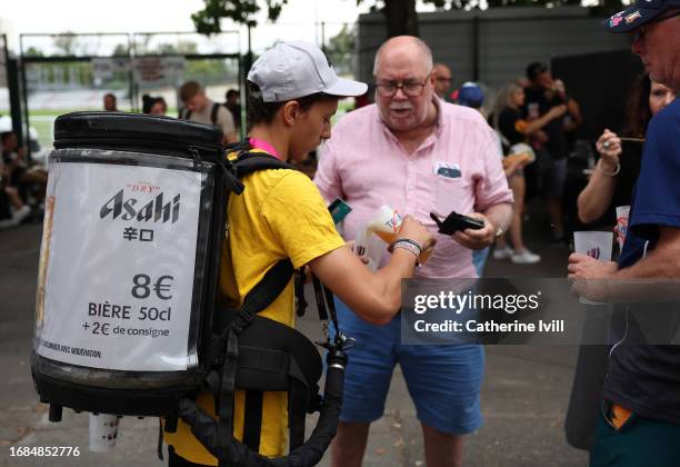 Vendor sells Asahi Beer to a supporter ahead of the Rugby World Cup France 2023 match between New Zealand and Namibia at Stadium de Toulouse on...