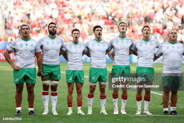 The players of Portugal line up during the National Anthems prior to the Rugby World Cup France 2023 match between Wales and Portugal at Stade de...