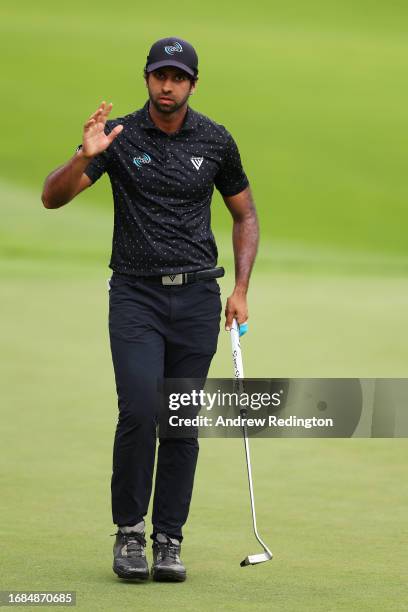 Aaron Rai of England acknowledges the crowd after putting on the 18th green during Day Three of the BMW PGA Championship at Wentworth Golf Club on...