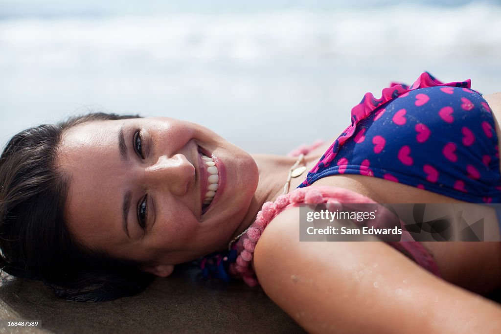 Woman lying on beach