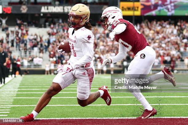 Lewis Bond of the Boston College Eagles scores a touchdown past Fentrell Cypress II of the Florida State Seminoles during the first half at Alumni...