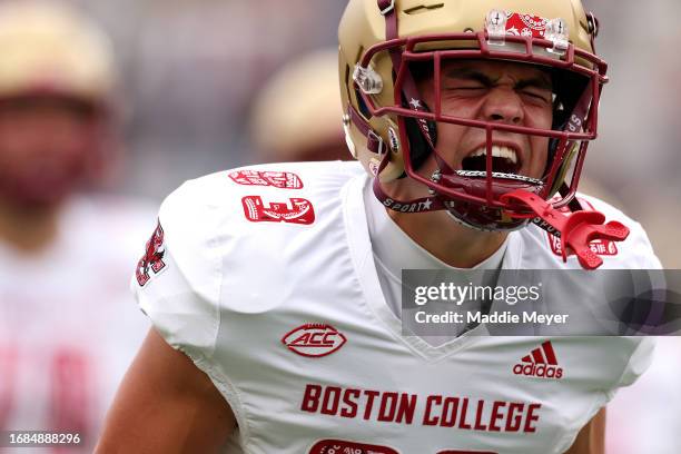 Luke McLaughlin of the Boston College Eagles yells as he runs onto the field before the game between the Florida State Seminoles and the Boston...