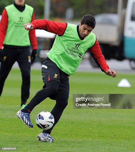 Luis Suarez of Liverpool controls the ball during a training session at Melwood Training Ground on May 10, 2013 in Liverpool, England.