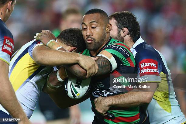 Roy Asotasi of the Rabbitohs is tackled during the round nine NRL match between the South Sydney Rabbitohs and the North Queensland Cowboys at ANZ...