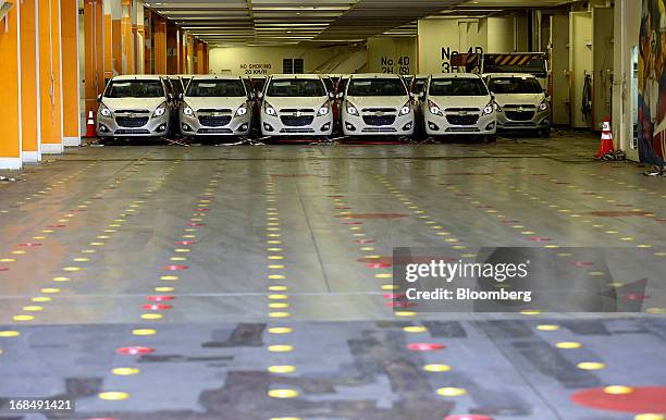 Chevrolet Spark EV automobiles stand aboard the "Silverstone Express" vehicle carrier at the port of Koper, operated by Luka Koper d.d., in Koper,...