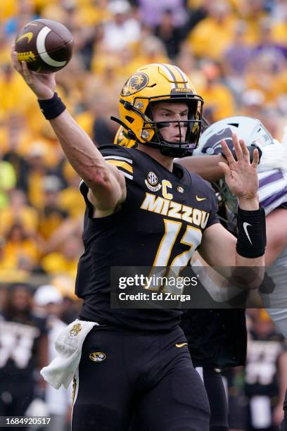 Quarterback Brady Cook of the Missouri Tigers passes against the Kansas State Wildcats in the first half at Faurot Field/Memorial Stadium on...