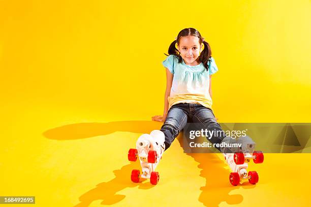 beautiful young girl on roller skates - roller skate stock pictures, royalty-free photos & images