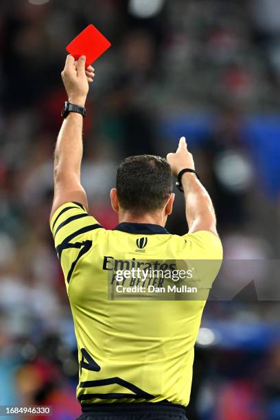 Referee Karl Dickson presents a red card to Vincent Pinto of Portugal after TMO Bunker Review escalates the initial Yellow Card decision to a Red...