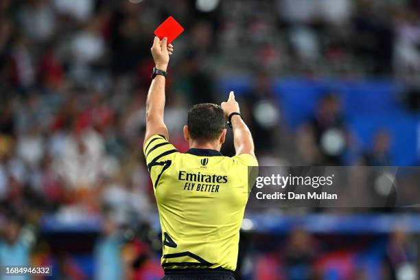 Referee Karl Dickson presents a red card to Vincent Pinto of Portugal after TMO Bunker Review escalates the initial Yellow Card decision to a Red...