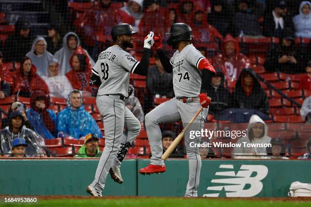 Luis Robert Jr. #88 of the Chicago White Sox celebrates his home run with teammate Eloy Jimenez during the ninth inning of their 1-0 win over the...