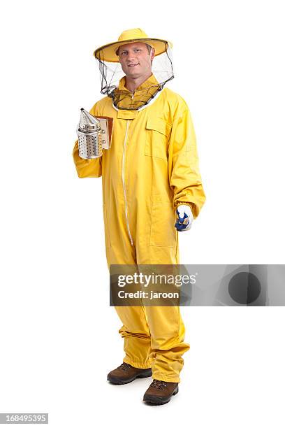 beekeeper in yellow uniform - apiculture stock pictures, royalty-free photos & images