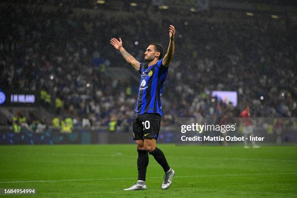 Hakan Calhanoglu of FC Internazionale celebrates after scoring their team's fourth goal during the Serie A TIM match between FC Internazionale and AC...