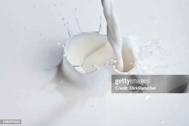 pouring milk - milk splash stock pictures, royalty-free photos & images